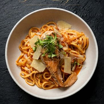 Pasta with grilled chicken and cheese.