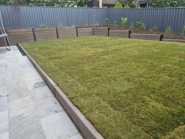 Concrete sleepers retaining wall and Canberra blend turf