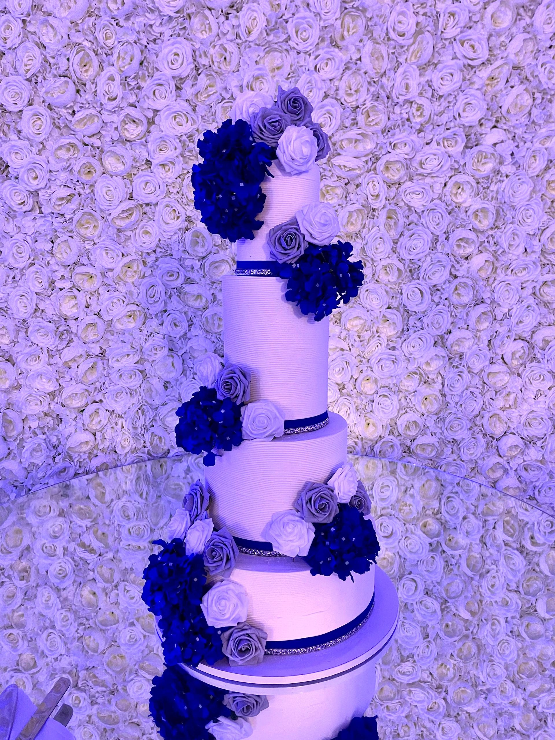 4 tier blue and white wedding cake 