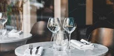 Table set with two wine glasses.