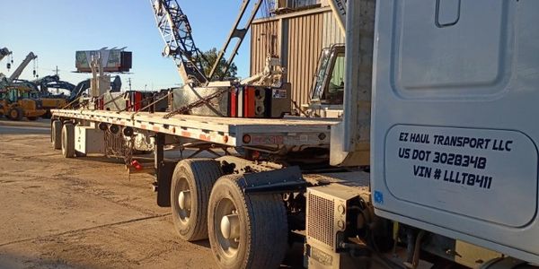 Semi flatbed delivering counter weights in texas.