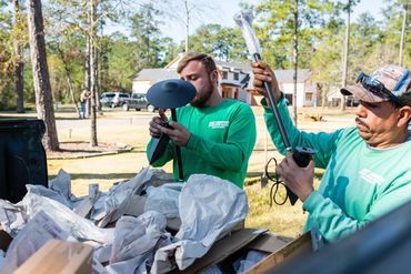 LED outdoor lighting being installed. Men working landscape