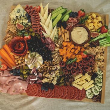 Large grazing board, selection of meat and cheese.