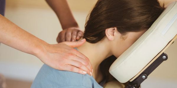 Person receiving a shoulder massage.