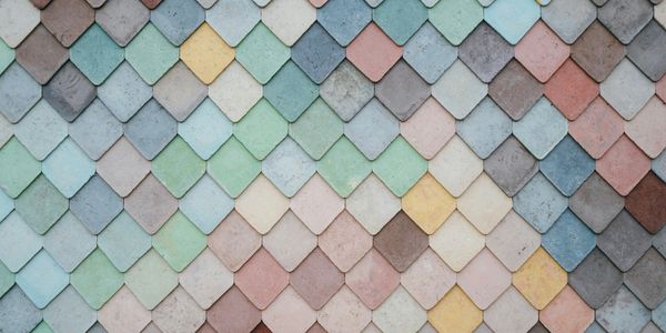 Colorful overlapping diamond-shaped tiles arranged in a pattern.