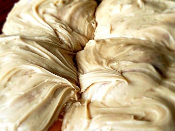 Close-up of creamy beige frosting swirls.