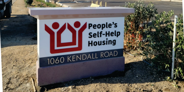 People's Self-Help Housing kendall road monument 2 sided logo business office