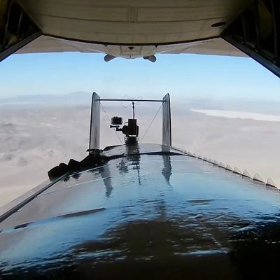 A Silent Arrow GD-2000 is deployed from a C-130 by rolling backwards and separating from cargo ramp.