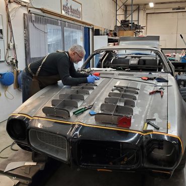 The start of a hand build steel hood with functioning hood scoops