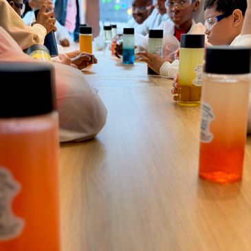 Students conducting a colorful science experiment.