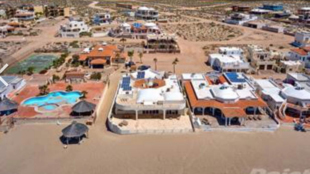 Aerial shot of the vacation home and the beach