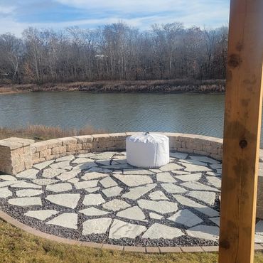 Retaining wall surrounding a functional paver patio