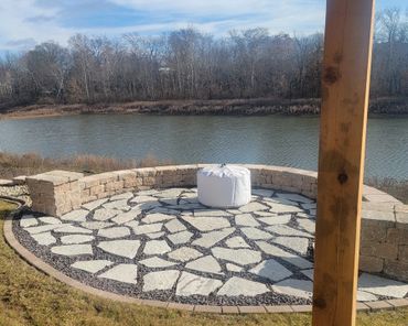 Retaining wall surrounding a functional paver patio