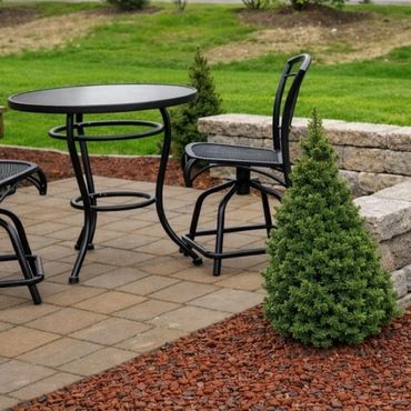 Retaining wall surrounding a functional paver patio