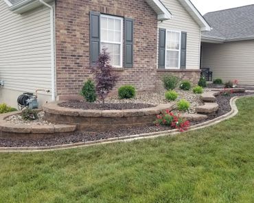 Aesthetic retaining wall, brick edging, and shrubs