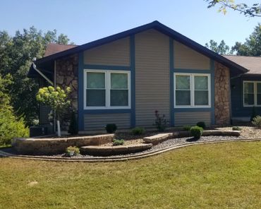 Aesthetic retaining wall, brick edging, and shrubs
