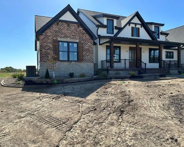 Aesthetic retaining wall, brick edging, and shrubs
