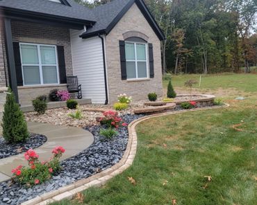 Aesthetic retaining wall, brick edging, and shrubs