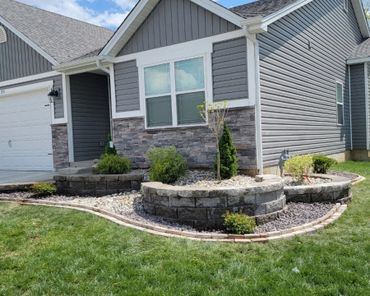 Aesthetic retaining wall, brick edging, and shrubs