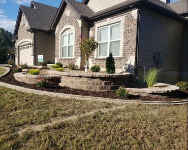 Aesthetic retaining wall, brick edging, and shrubs