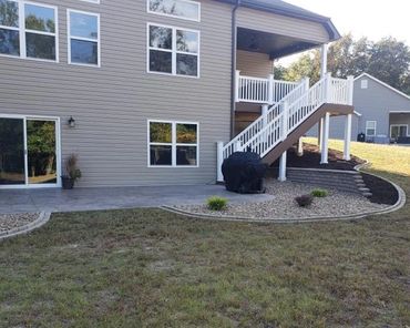 Aesthetic retaining wall, brick edging, and shrubs