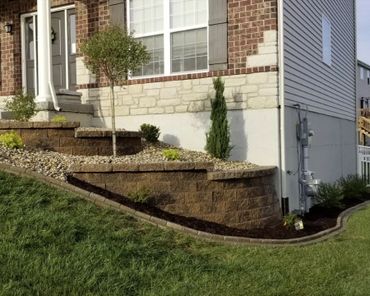 Aesthetic retaining wall, brick edging, and shrubs