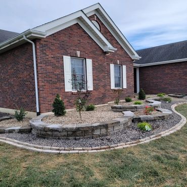 Aesthetic retaining wall, brick edging, and shrubs