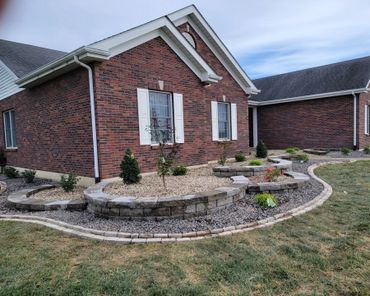 Aesthetic retaining wall, brick edging, and shrubs