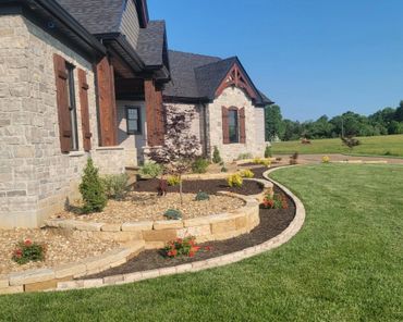 Aesthetic retaining wall, brick edging, and shrubs
