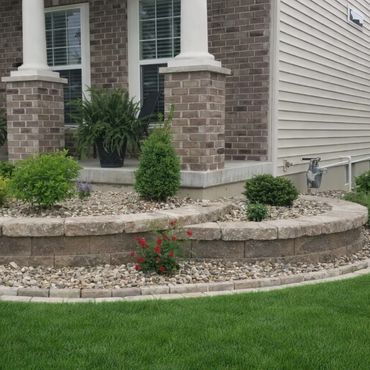 Aesthetic retaining wall, brick edging, and shrubs