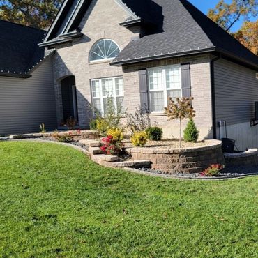 Well maintained suburban house with a landscaped front yard.
