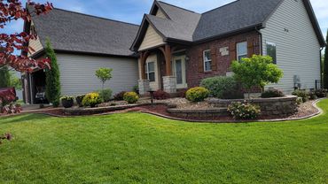 Retaining Wall, edging, and plantings designed and installed by Classic Landscape