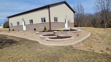 Retaining Wall, edging, and plantings designed and installed by Classic Landscape