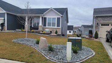 Retaining Wall, edging, and plantings designed and installed by Classic Landscape