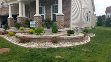 Retaining Wall, edging, and plantings designed and installed by Classic Landscape