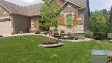 Retaining Wall, edging, and plantings designed and installed by Classic Landscape