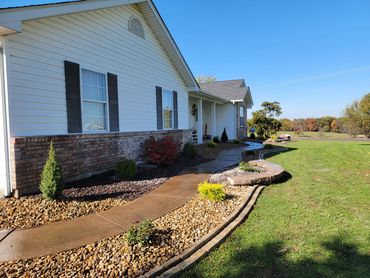 Retaining Wall, edging, and plantings designed and installed by Classic Landscape