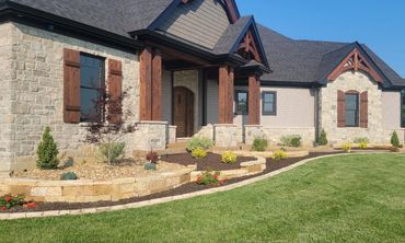 Retaining Wall, edging, and plantings designed and installed by Classic Landscape