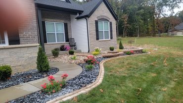 Retaining Wall, edging, and plantings designed and installed by Classic Landscape