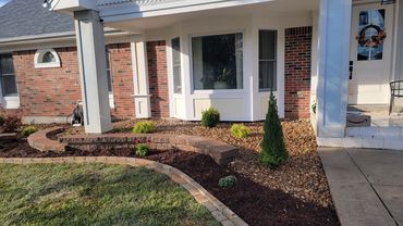 Retaining Wall, edging, and plantings designed and installed by Classic Landscape