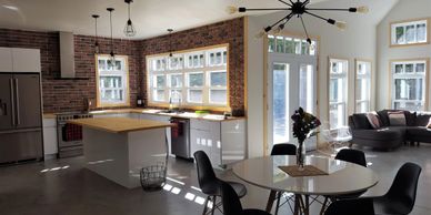 MODERN industrial KITCHEN AND LIVING GLOSS WHITE KITCHEN AND RED BRICK BACKSPLASH ASENADESIGN 