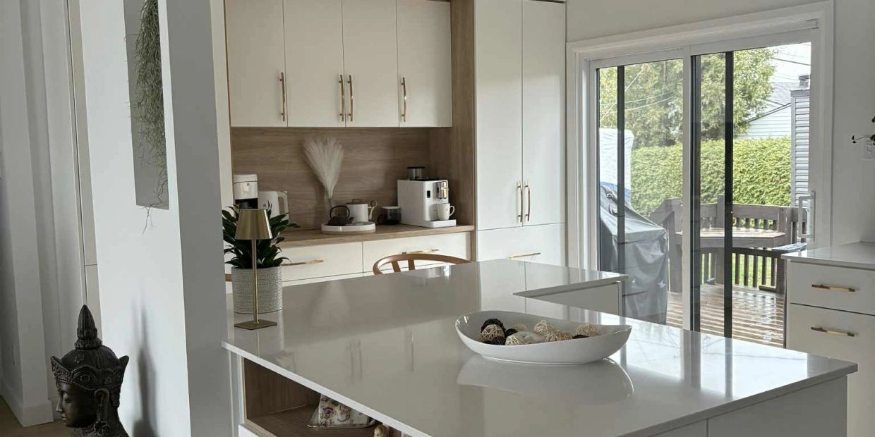 This kitchen renovation embraces a soft contemporary aesthetic where warmth, simplicity, and functio