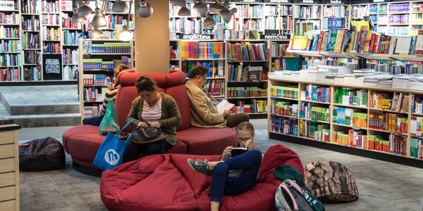 people staying at the library, reading books and relaxing