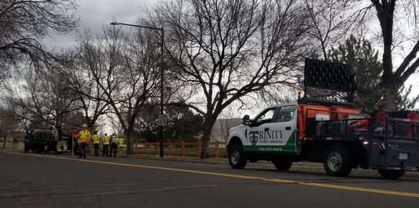 Trinity employees and traffic directional truck.