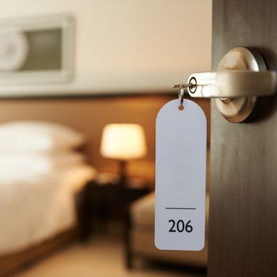 A picture of a key with number 206 hanging on the door