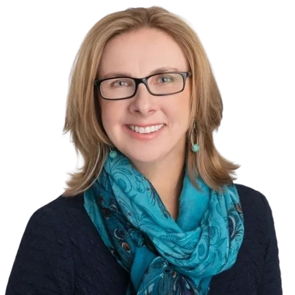 Image of woman with blonde should length hair, blue scarf and glasses. Headshot of Maggie Brubaker, 