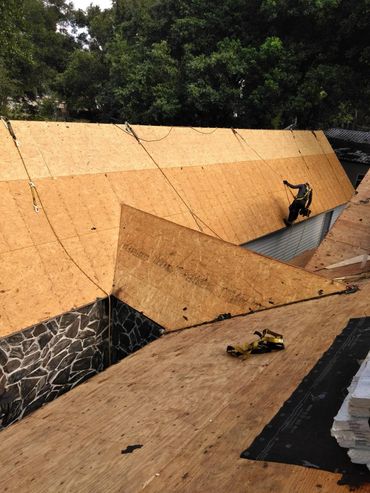 Roof replacement re-nailing decking. On steep slope roofs safety is always first.