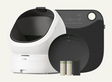 Modern automatic cat litter box with accessories and control panel.