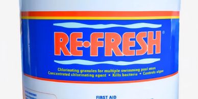 A container of RE-FRESH chlorinating granules for swimming pools.