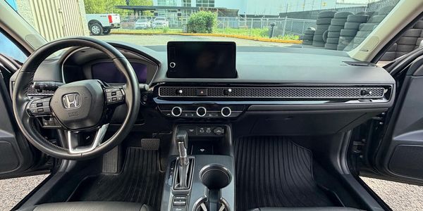 Modern Honda car interior with touchscreen and sleek dashboard design.